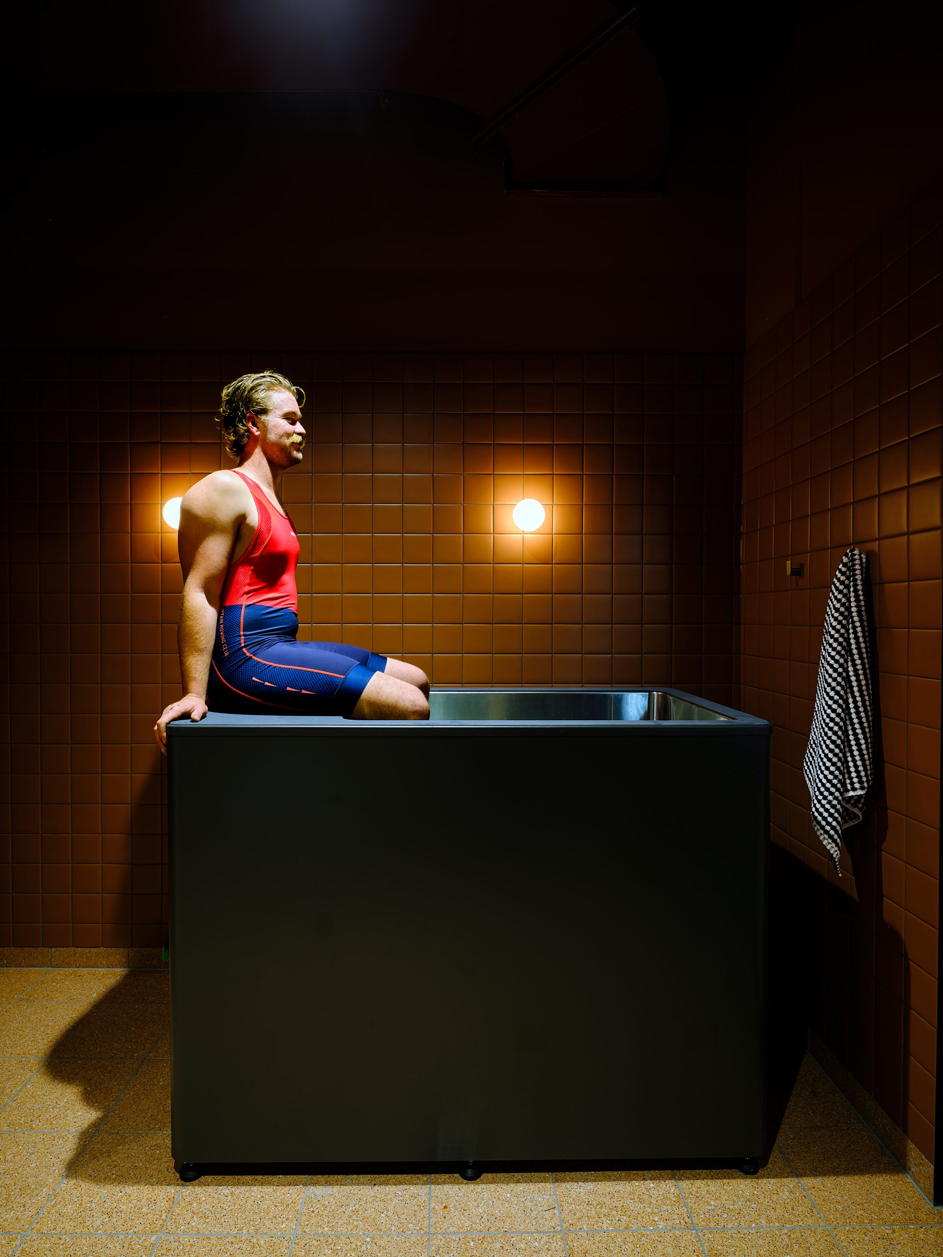 Sitting on the edge of the ice bath in the recovery room