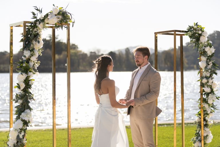 Wedding ceremony on the lakefront lawn at Red Shed