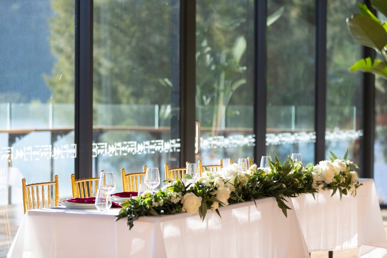 Head table dressed in burgundy and gold for a Telopea Room reception