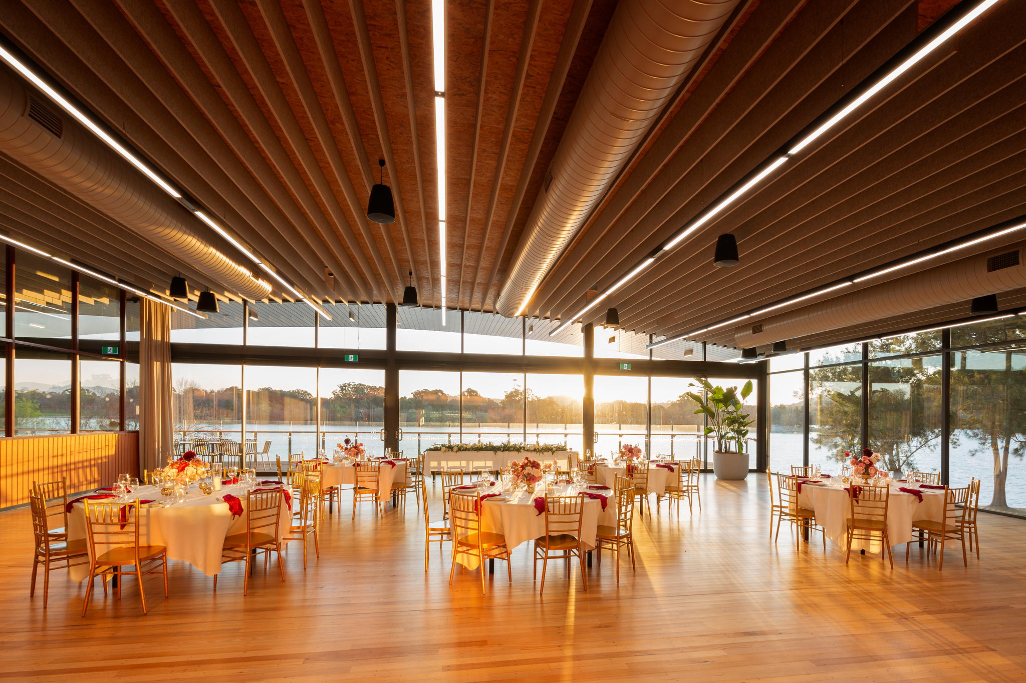 The timber ceiling of the Telopea Room above a dressed dining room