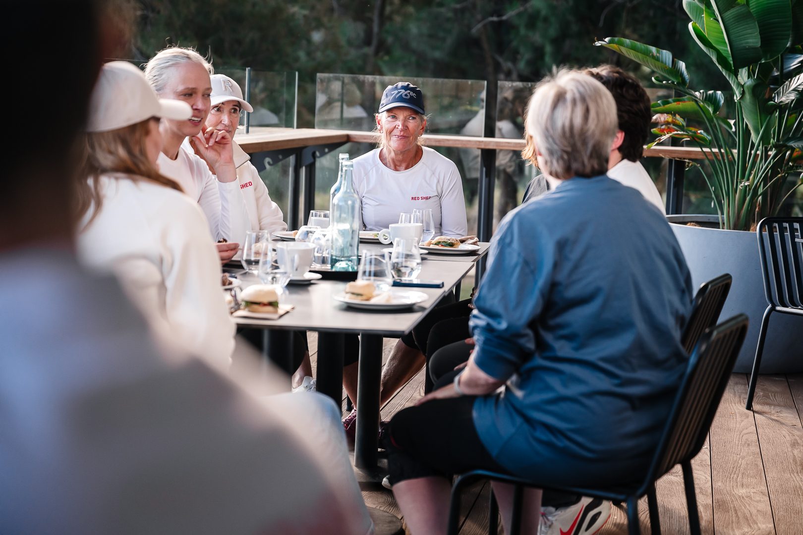 Group brunch on the Easy Oar deck, candid conversation