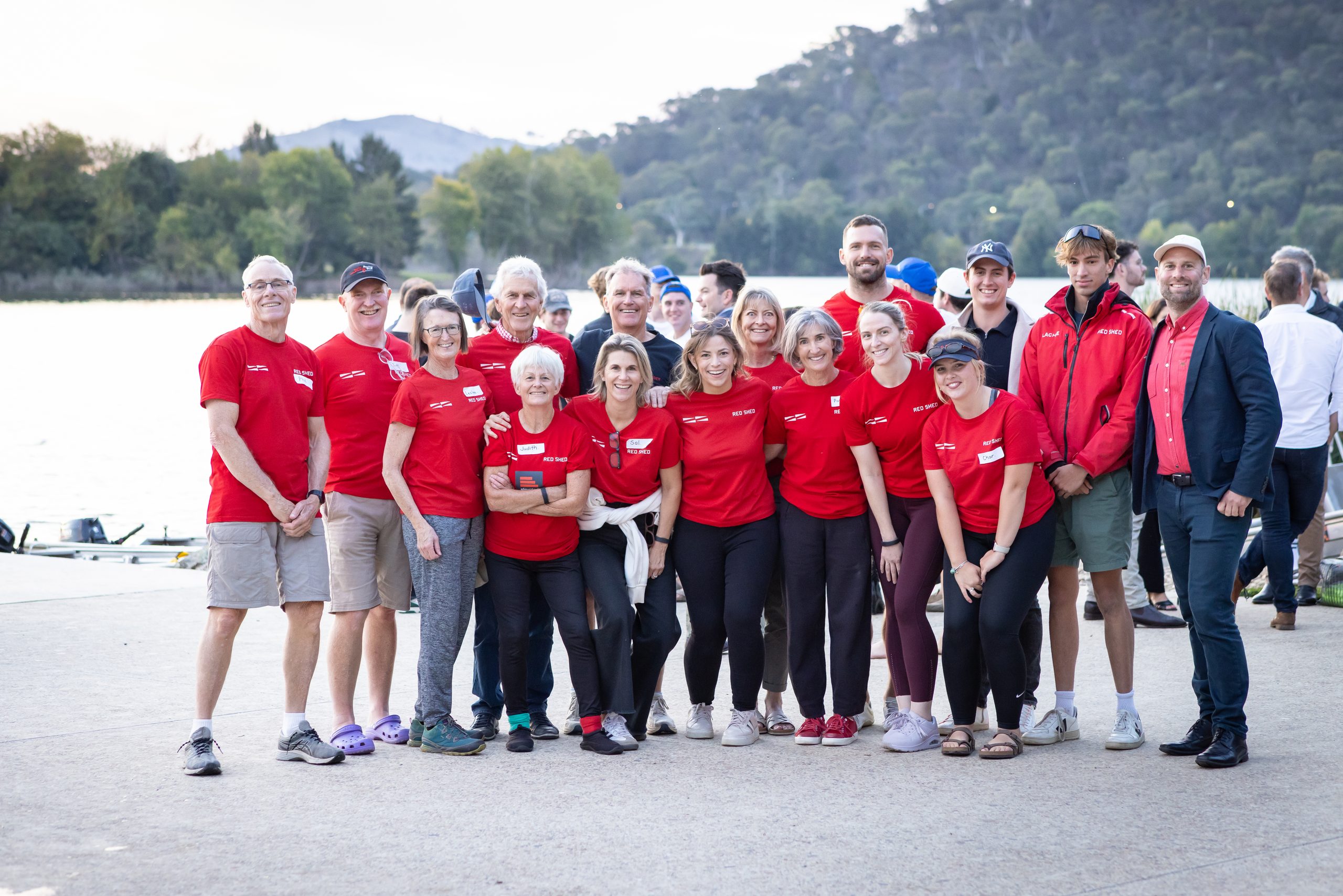 Red Shed team together at the water's edge
