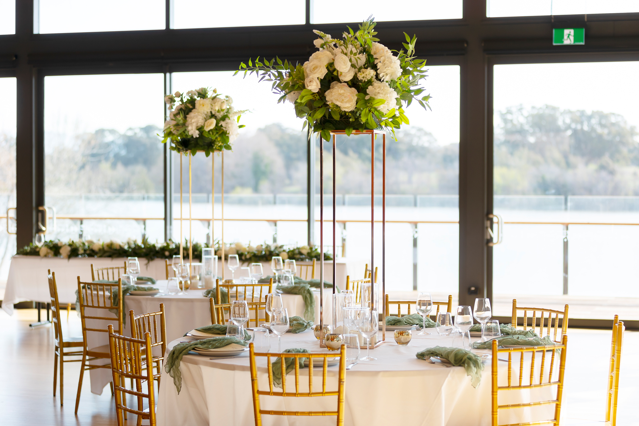 The Telopea Room set for a private dinner with white florals