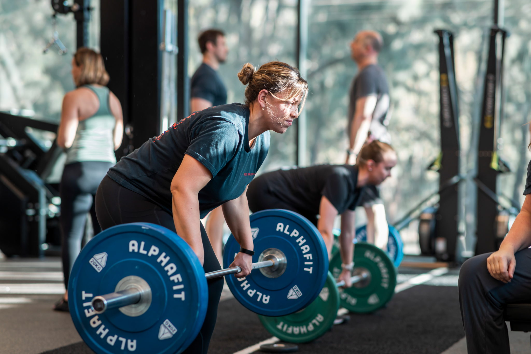 Member lifting a barbell at RSX Strength Club